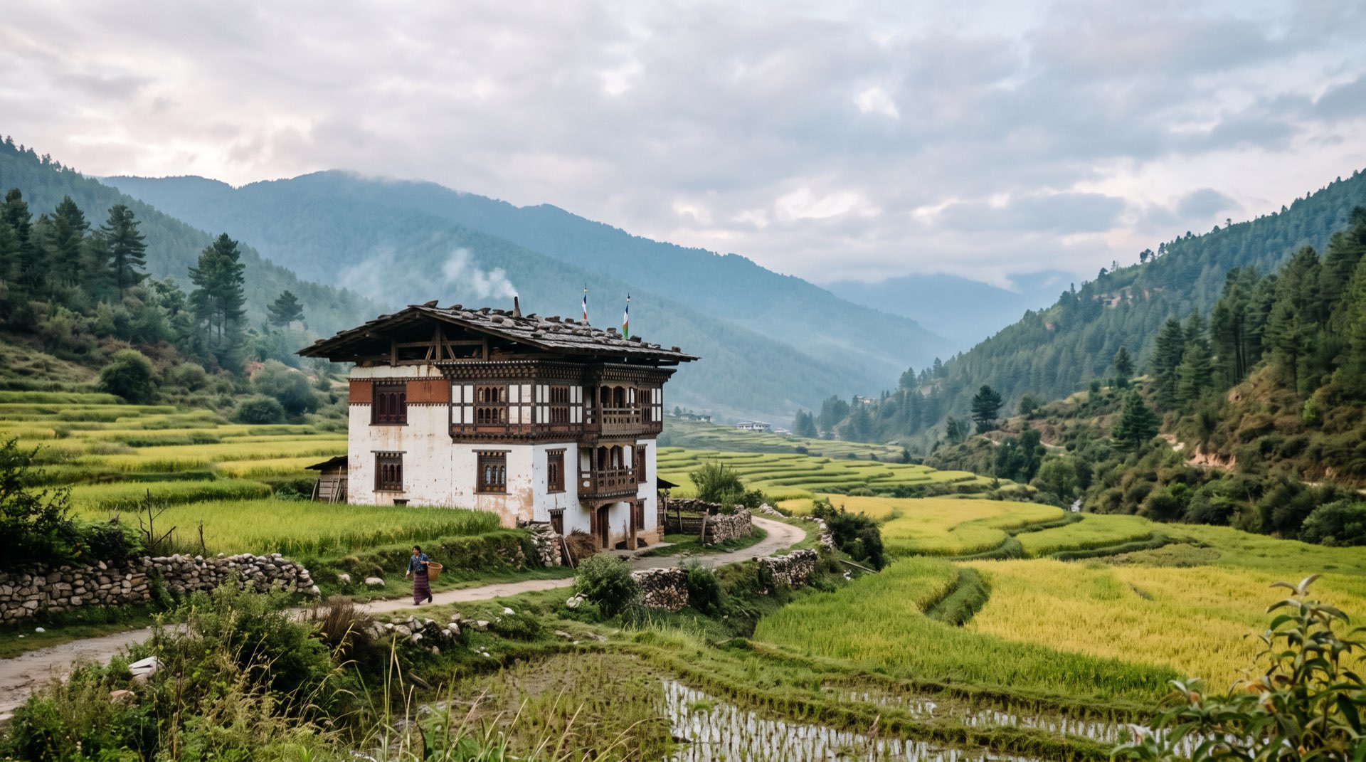 A three-storey farmhouse in a rice-field valley