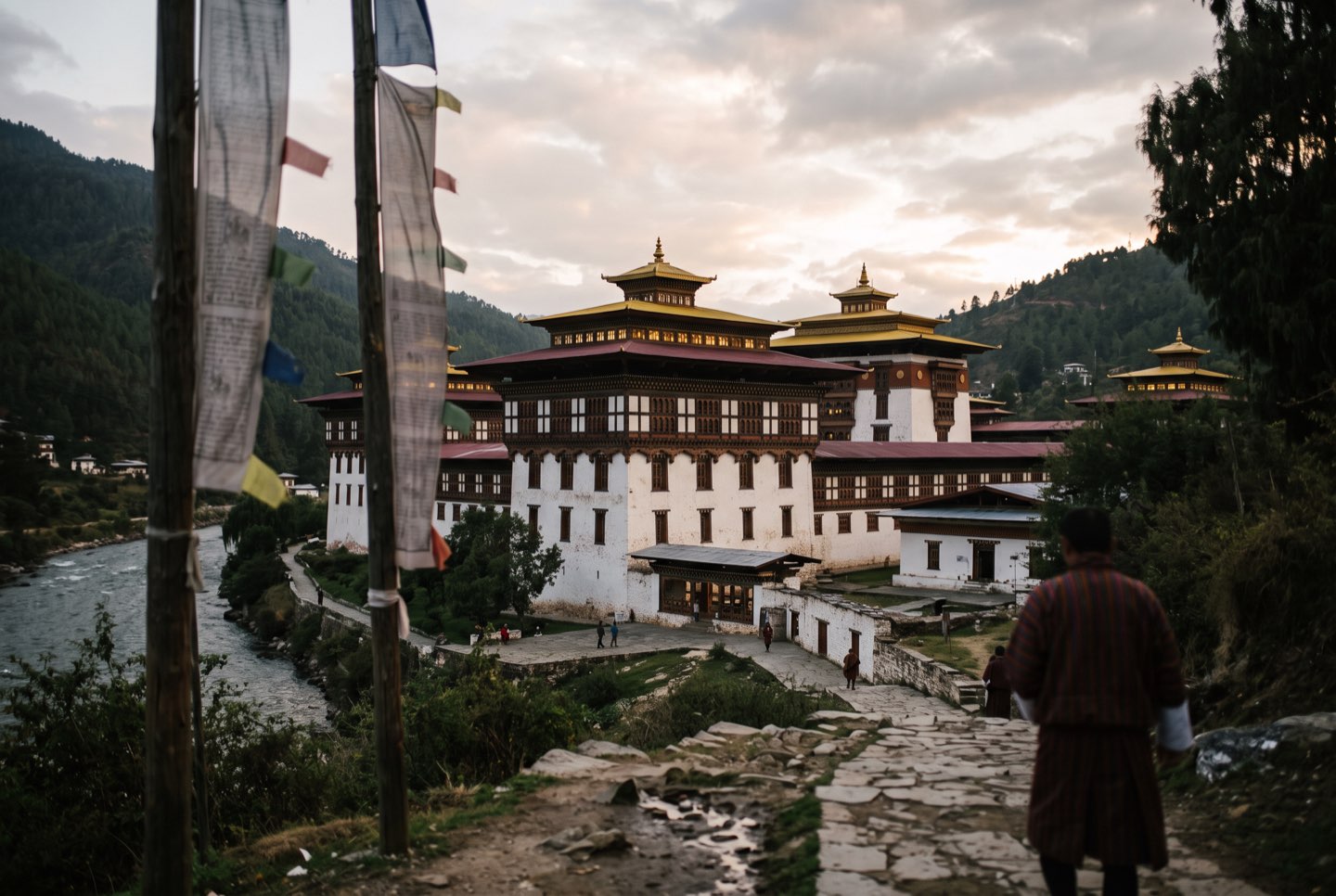 Tashichho Dzong in Thimphu at dusk with its golden roofs lit