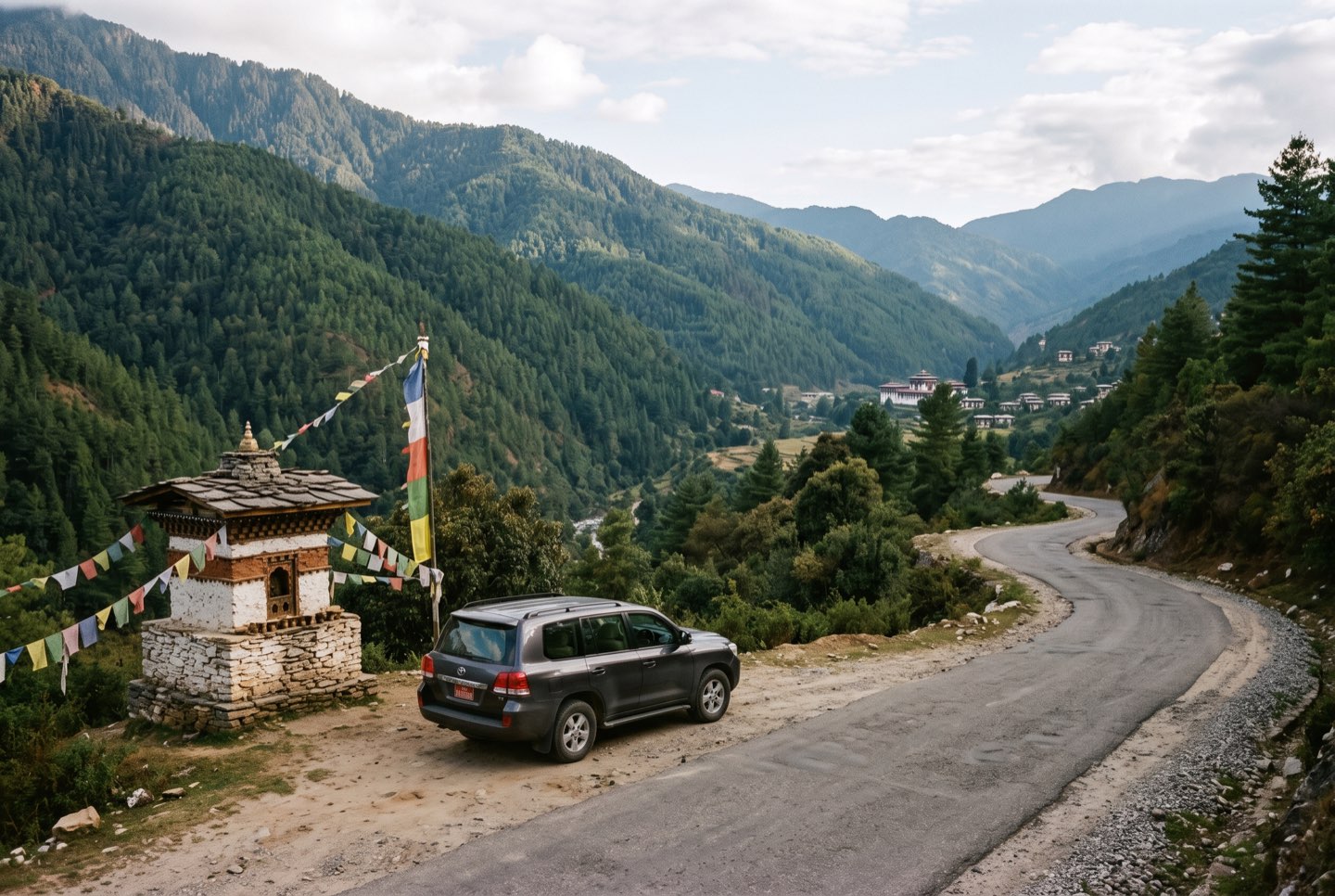 A private vehicle paused at a mountain-road viewpoint